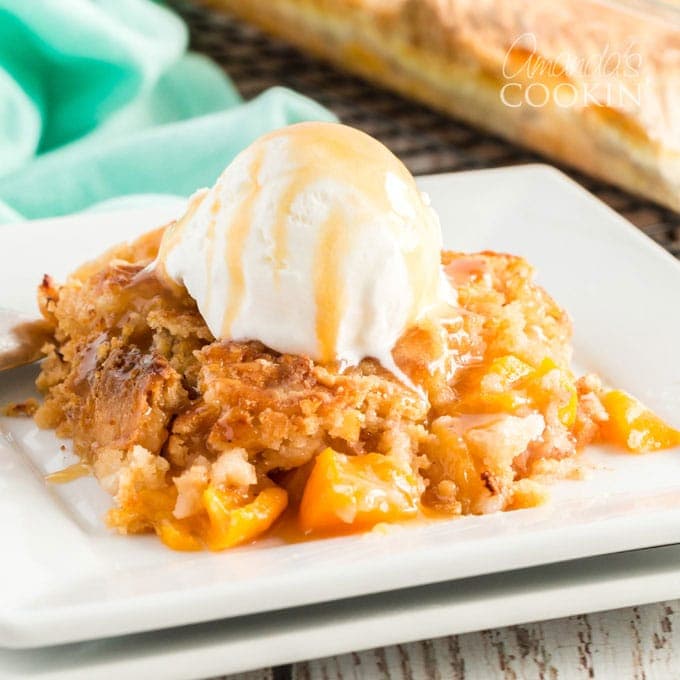 peach cobbler with vanilla ice cream on plate