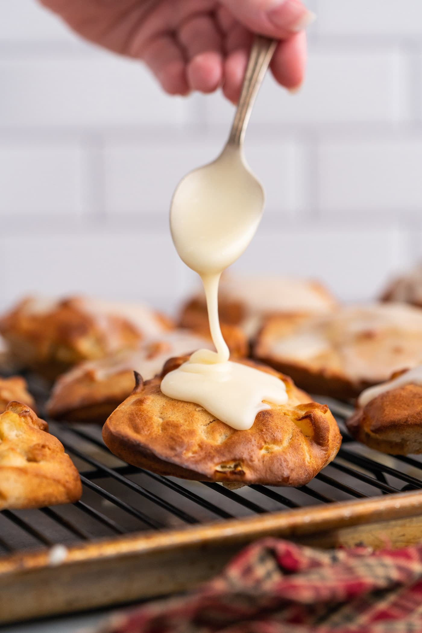 adding glaze to Air Fryer Apple Fritters