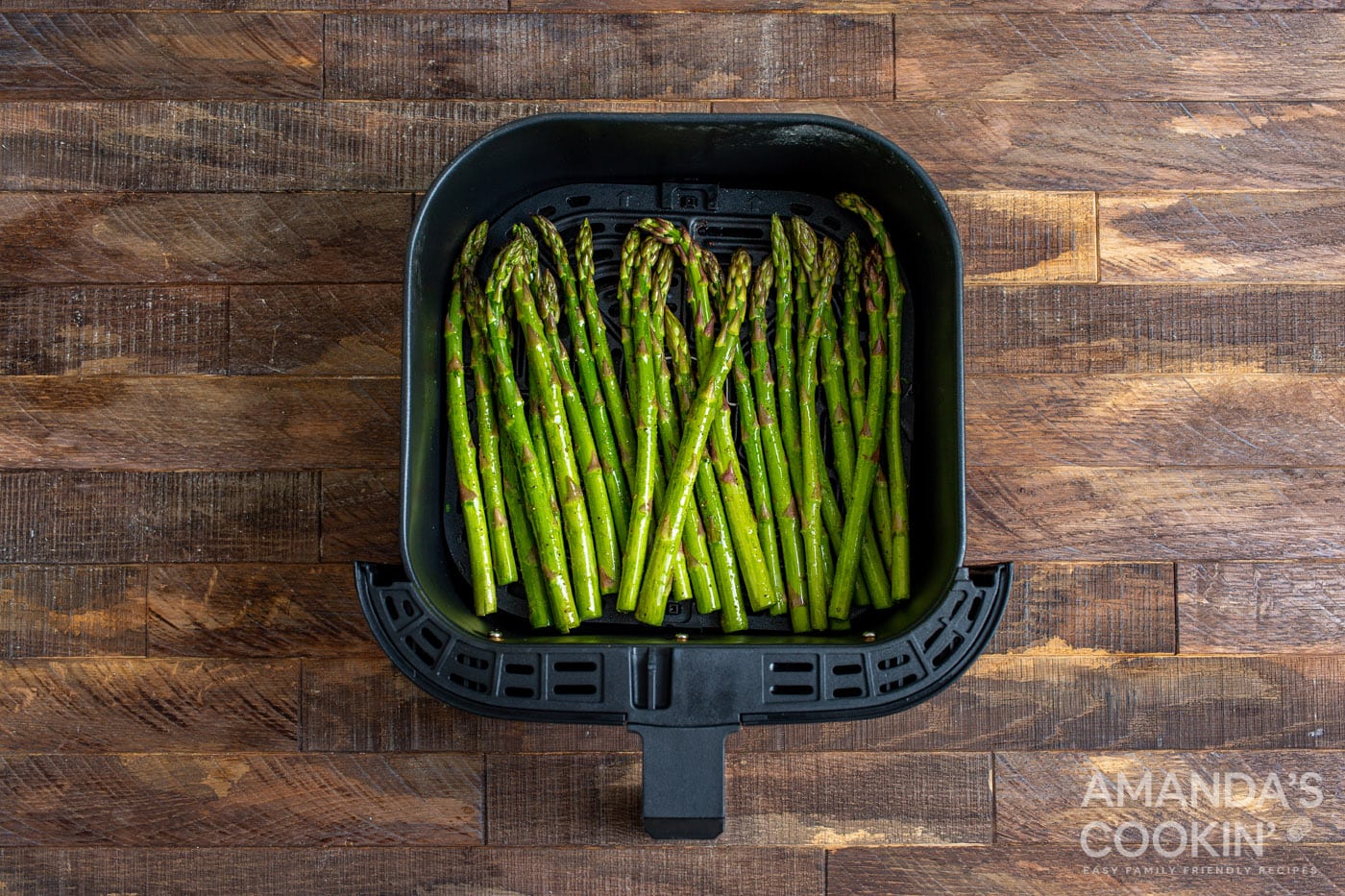 asparagus in an air fryer basket