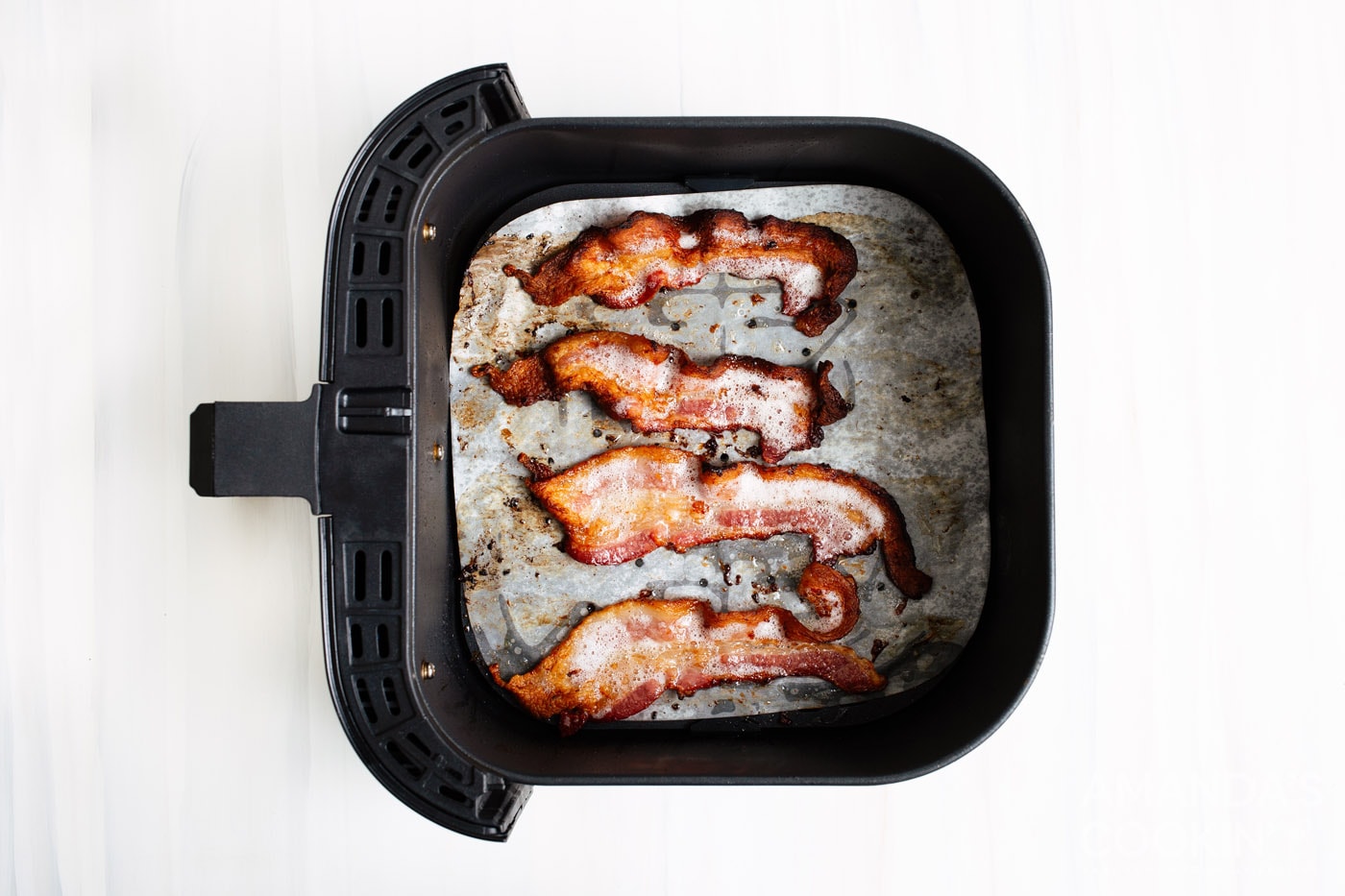 cooked bacon in air fryer basket
