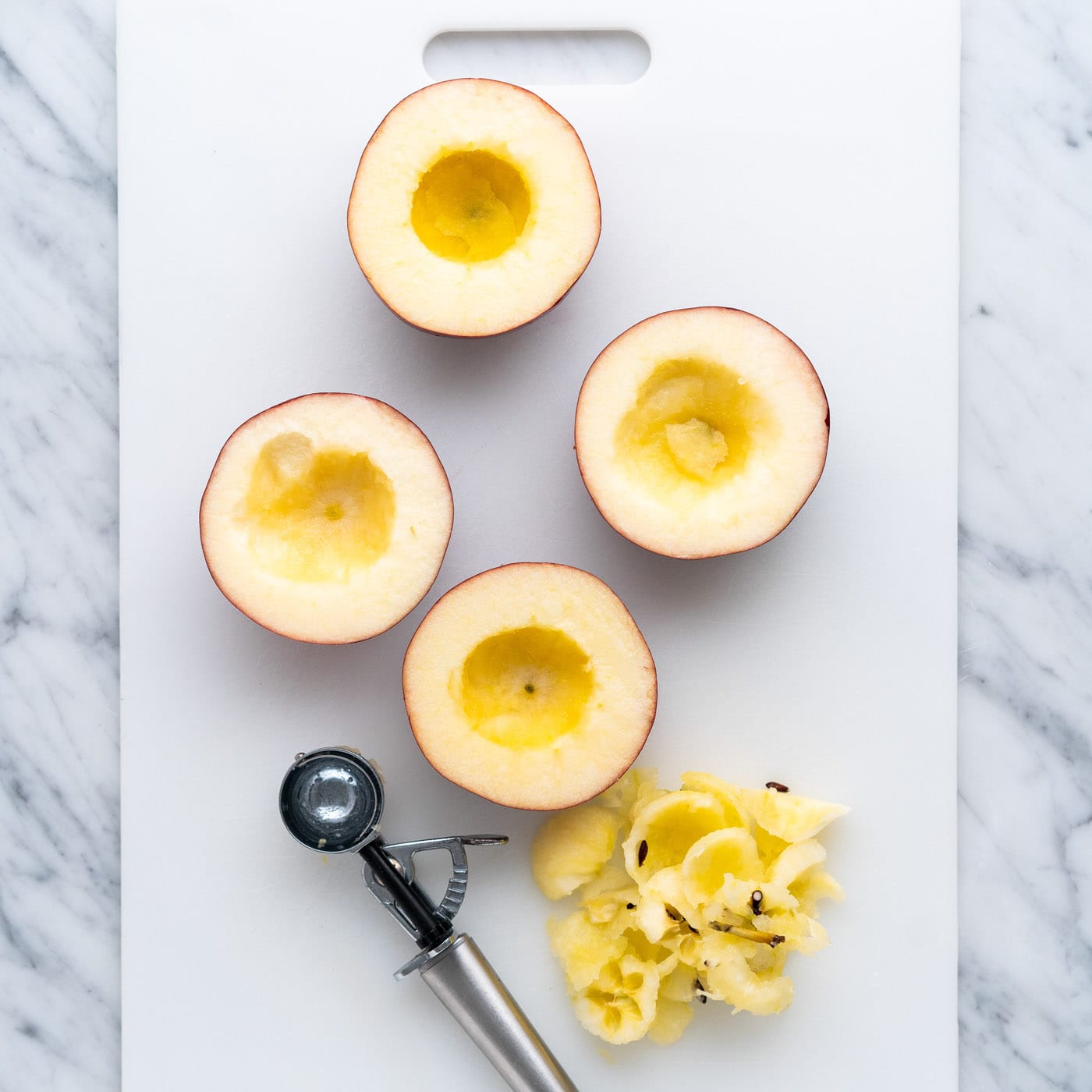 cored apple halves using a melon baller