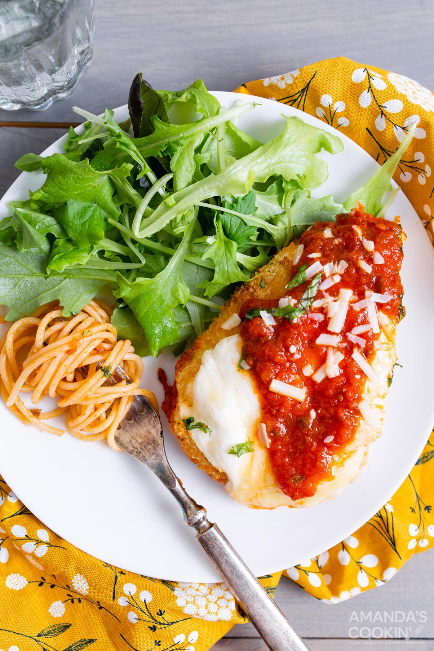 air fryer chicken parm on a plate with salad