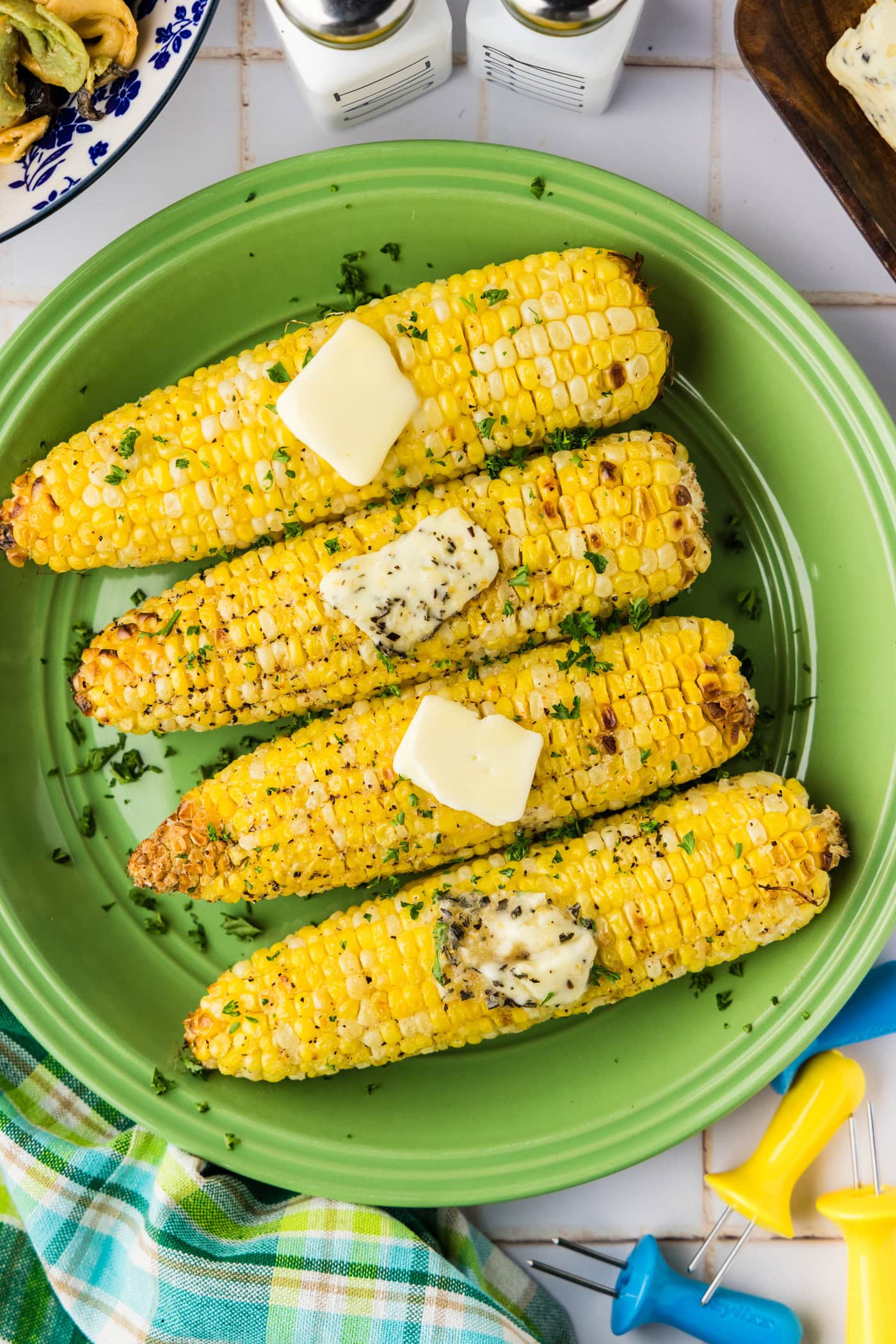 Air Fryer Corn on the Cob on a plate with butter