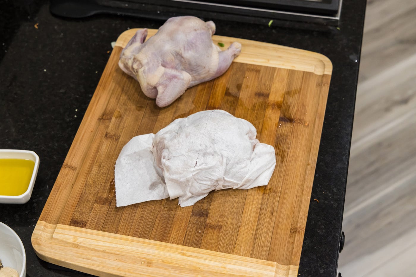 cornish hens on a wood cutting board