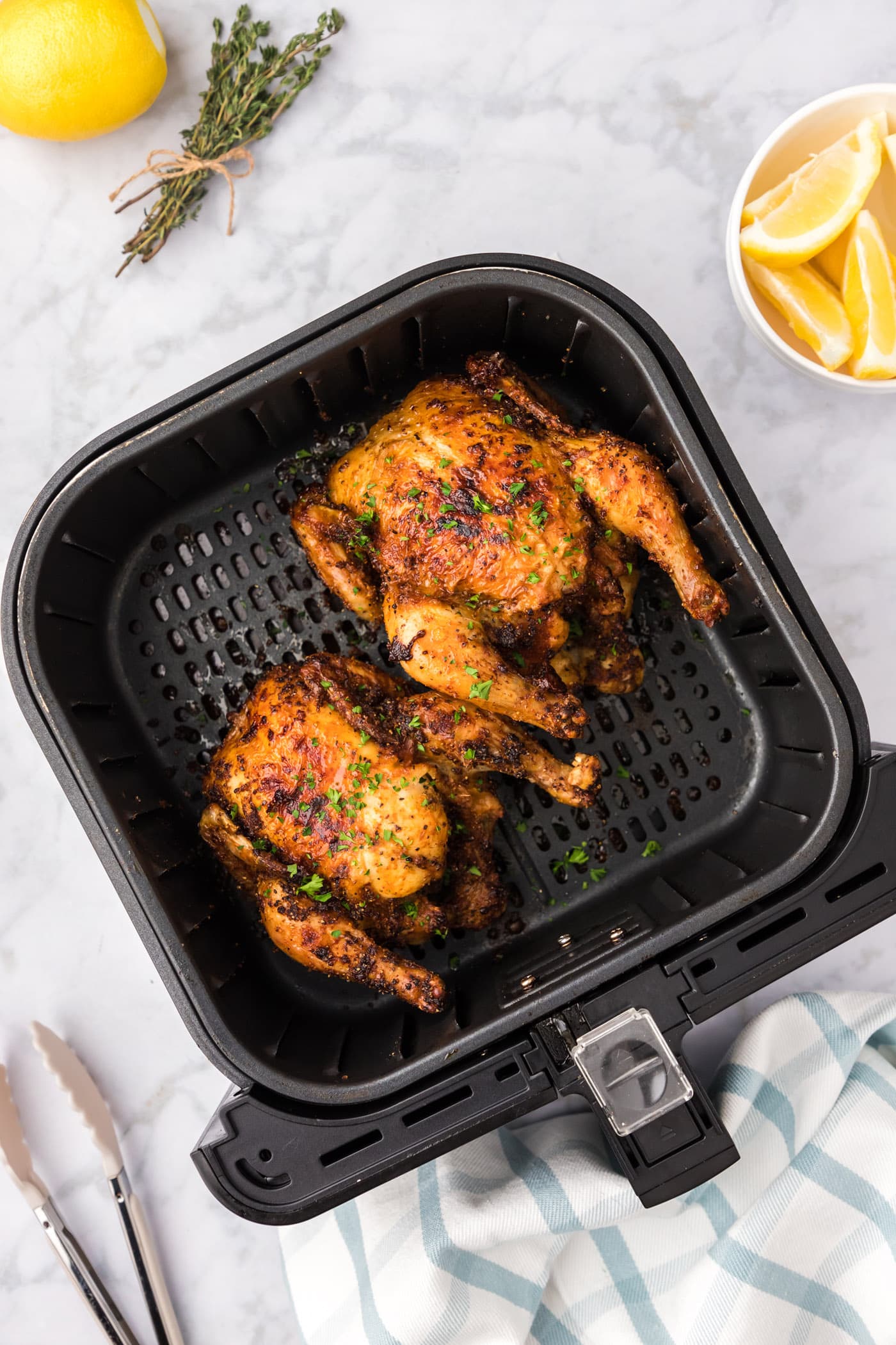 Air Fryer Cornish Hens in an air fryer basket