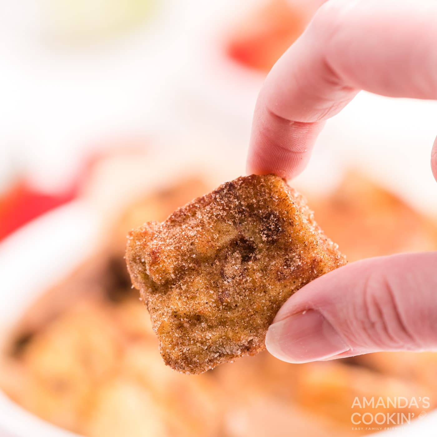 holding a french toast bite