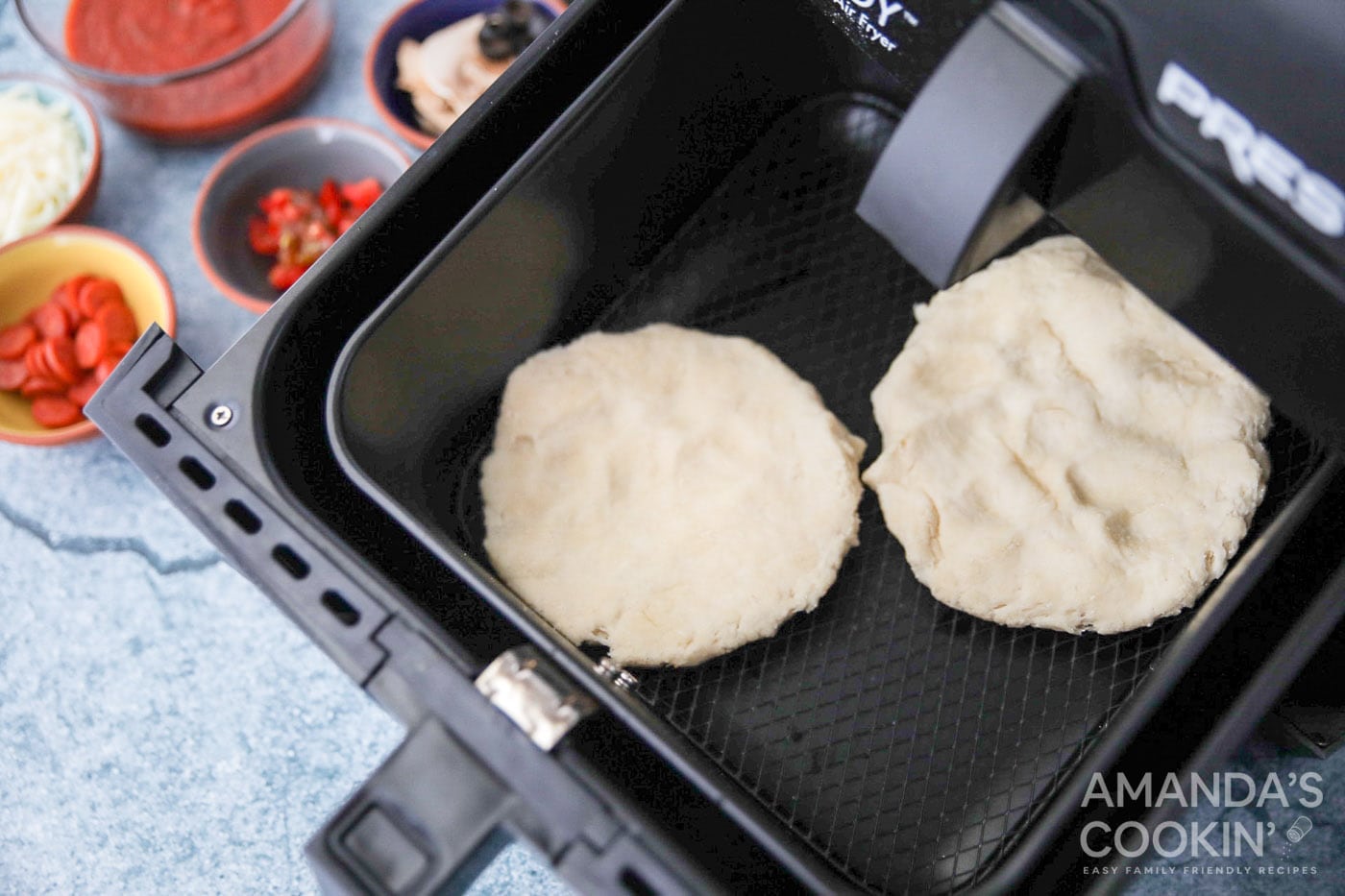 pizza dough circles in air fryer basket