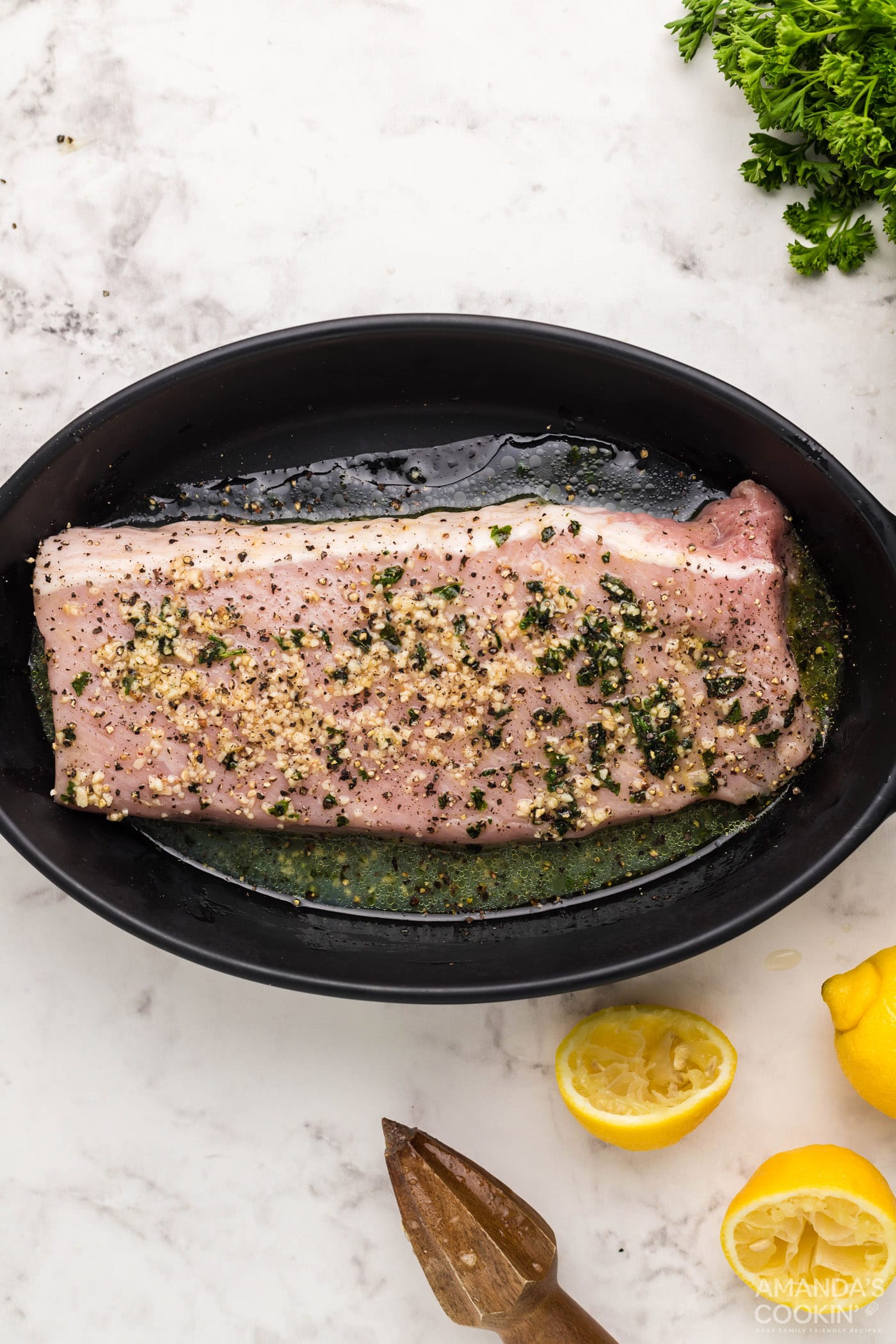 pork tenderloin marinating in a dish