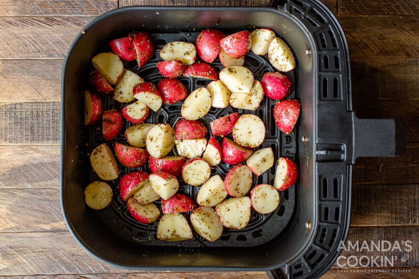 cubed potatoes in air fryer basket