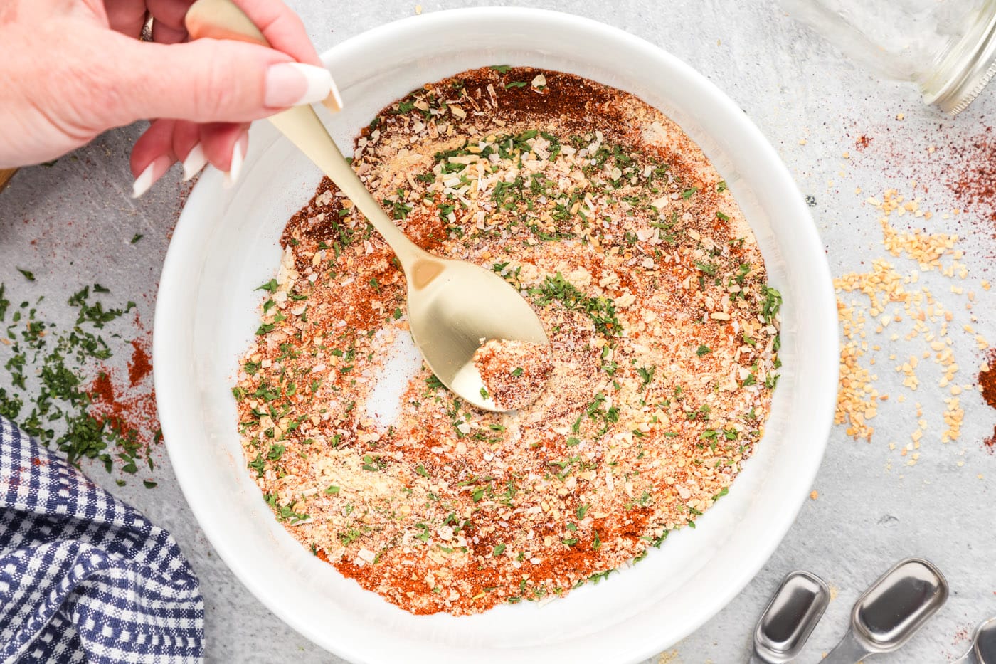 spoon mixing spices together in a bowl