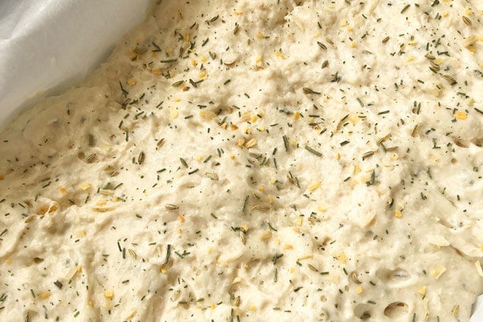 herbed bread dough in a pan
