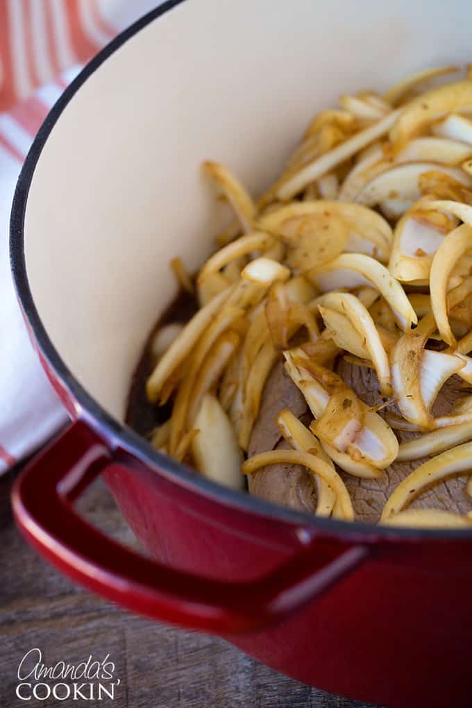 pan with onions on top of roast