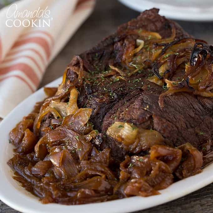 roast with onions on a platter
