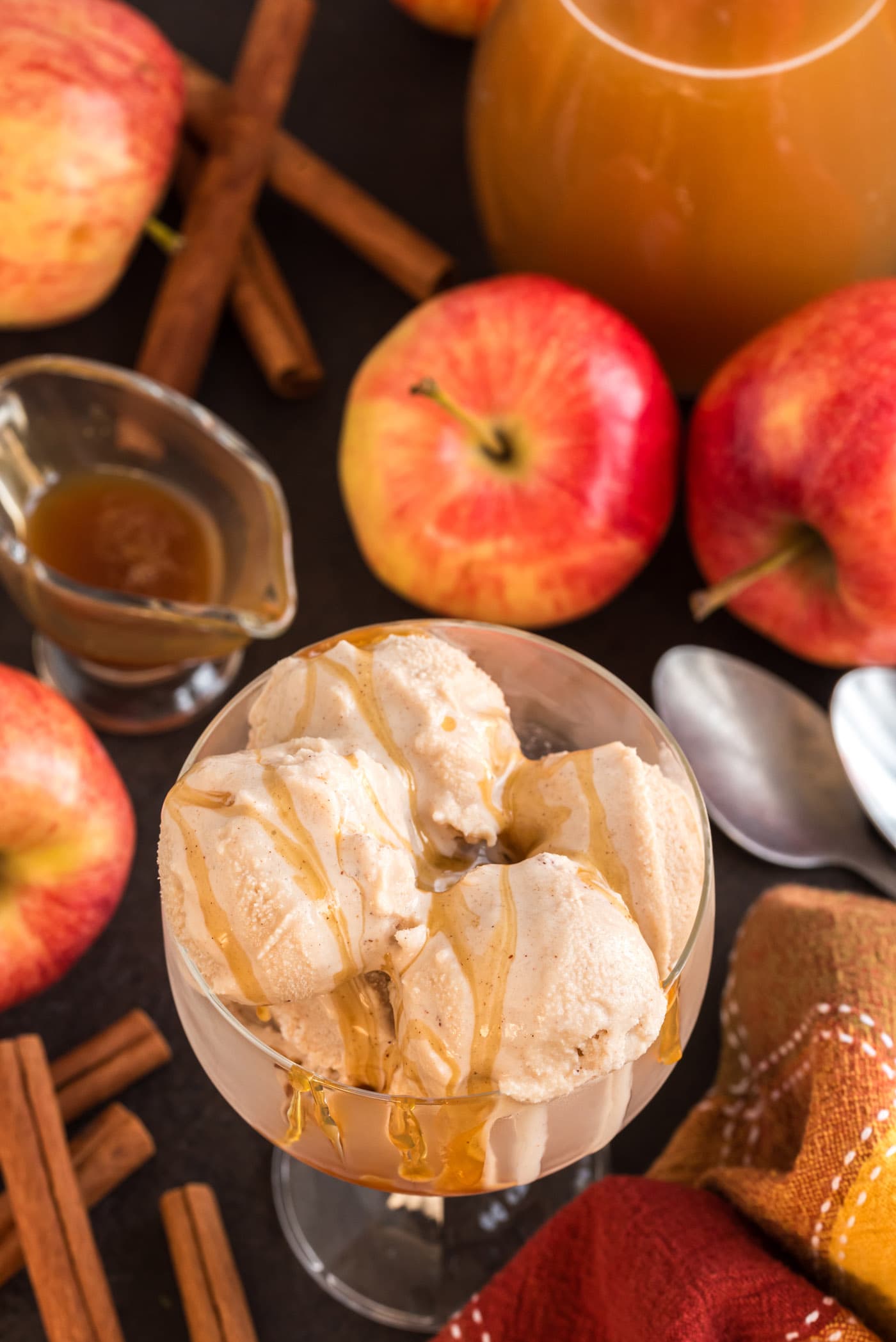 Scoops of Apple Cider Ice Cream in a dish with caramel drizzle on top