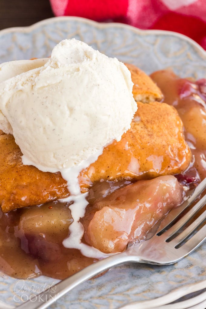 slice of apple crisp with melting vanilla ice cream on top