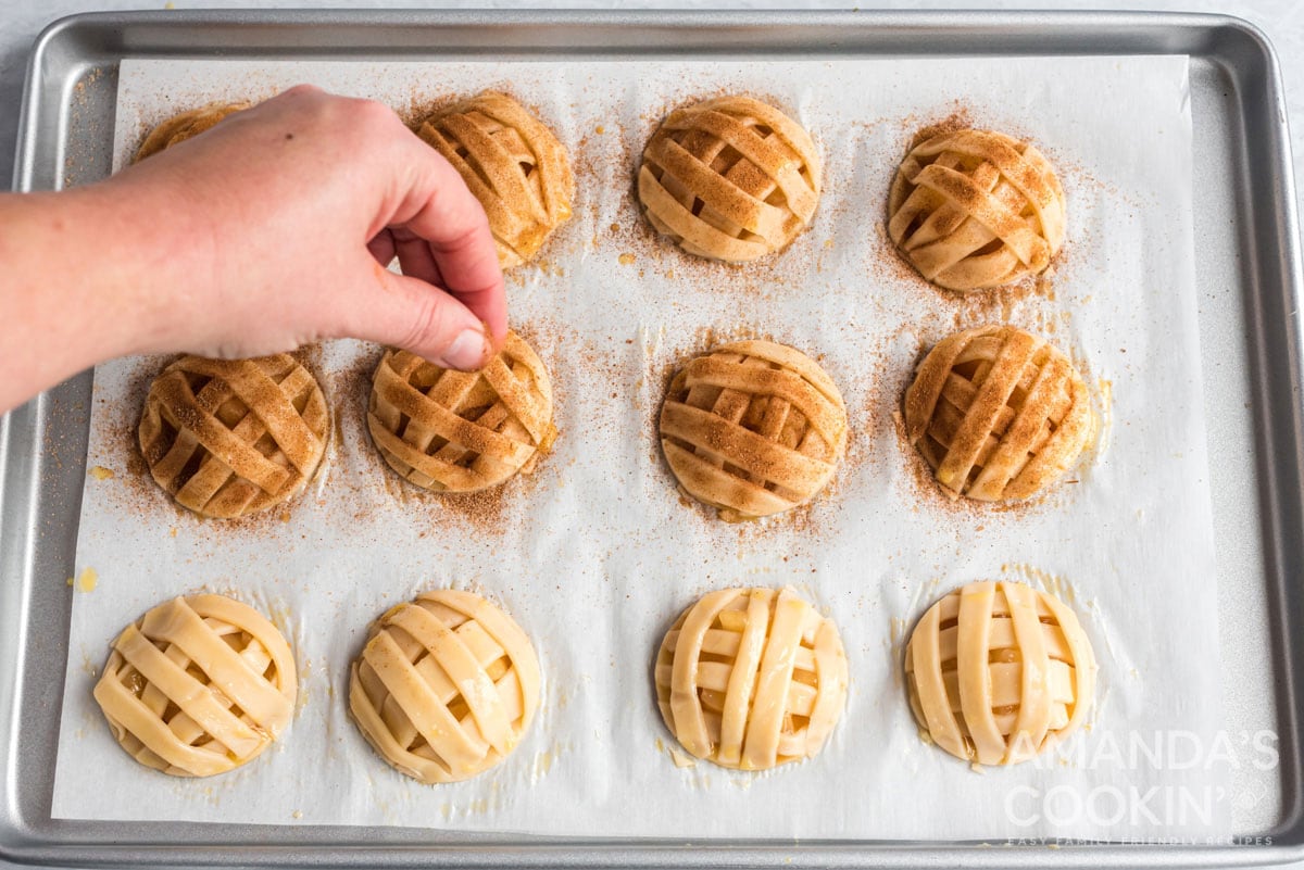 adding cinnamon sugar to pie dough