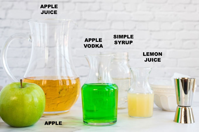 ingredients for an appletini - apple juice, apple vodka, lemon juice and simple syrup