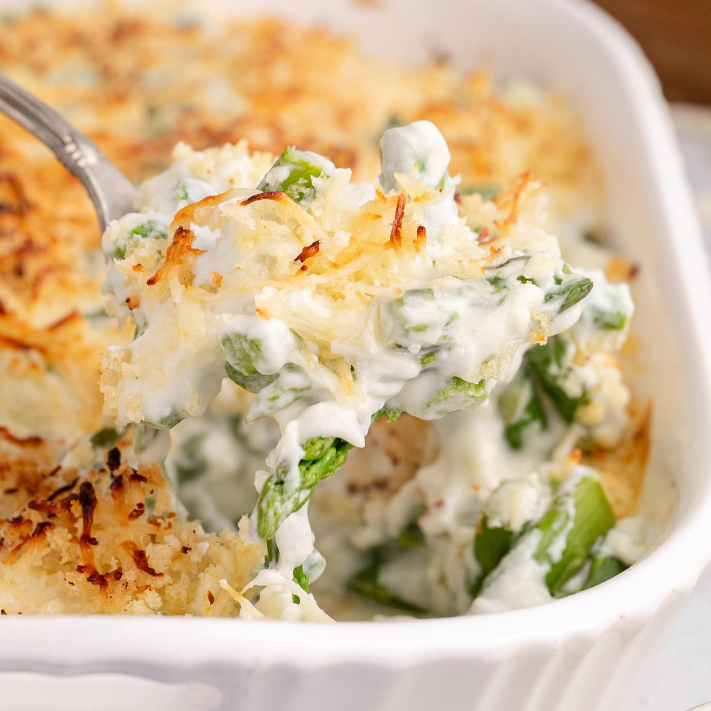 Close up photo of a spoonful of Asparagus Casserole