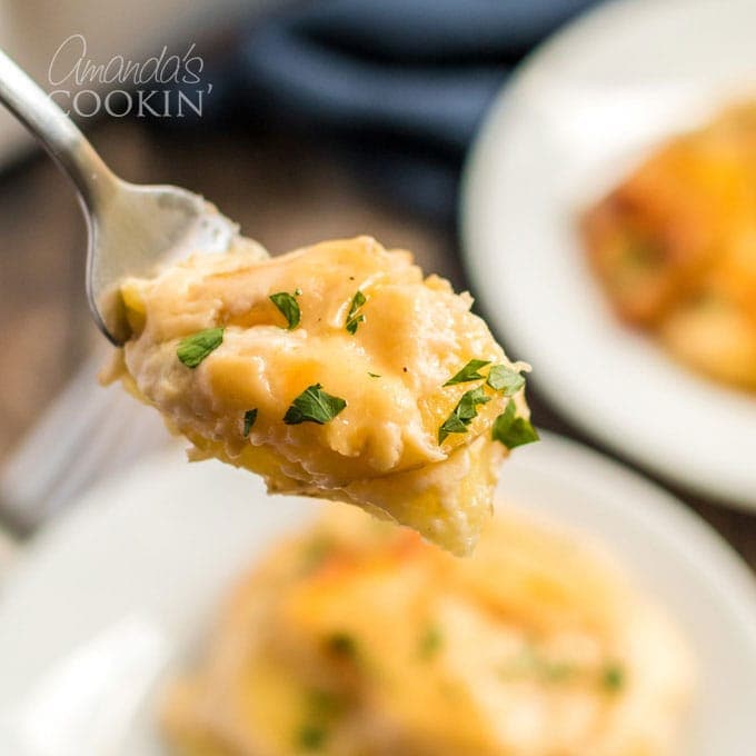 fork full of scalloped potatoes