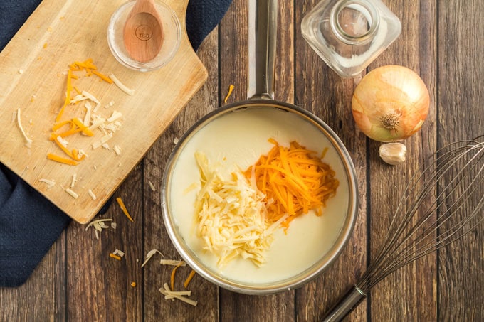 shredded cheese in saucepan