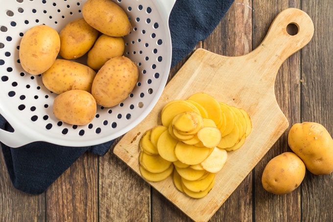 sliced potatoes on a cutting board