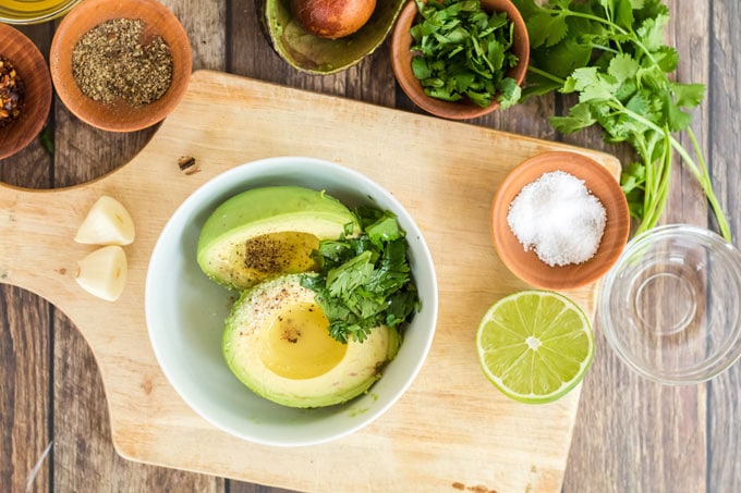 ingredients for avocado toast, avocados, cilantro, lime, salt, pepper