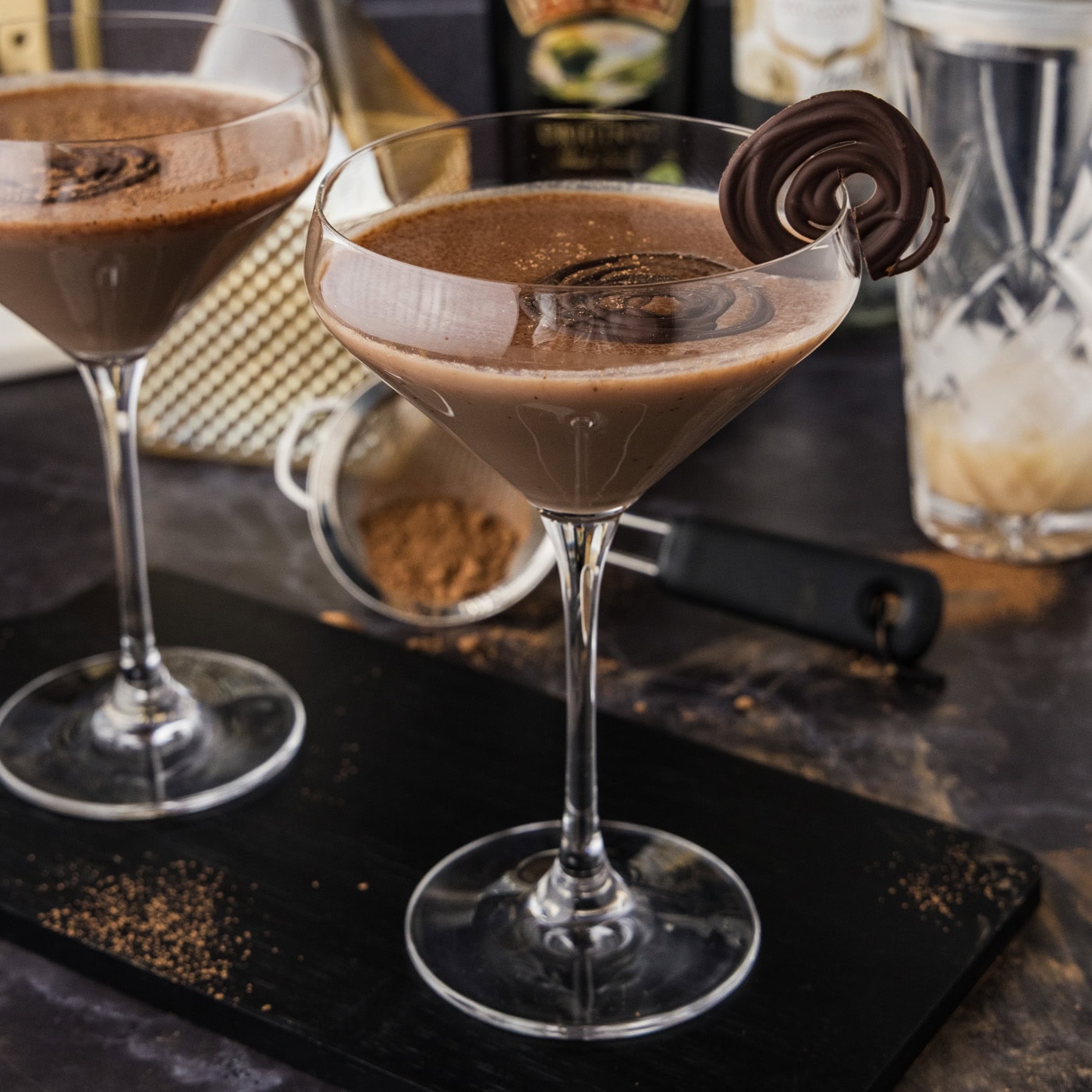 Baileys chocolate martini in a clear martini glass with another one behind it