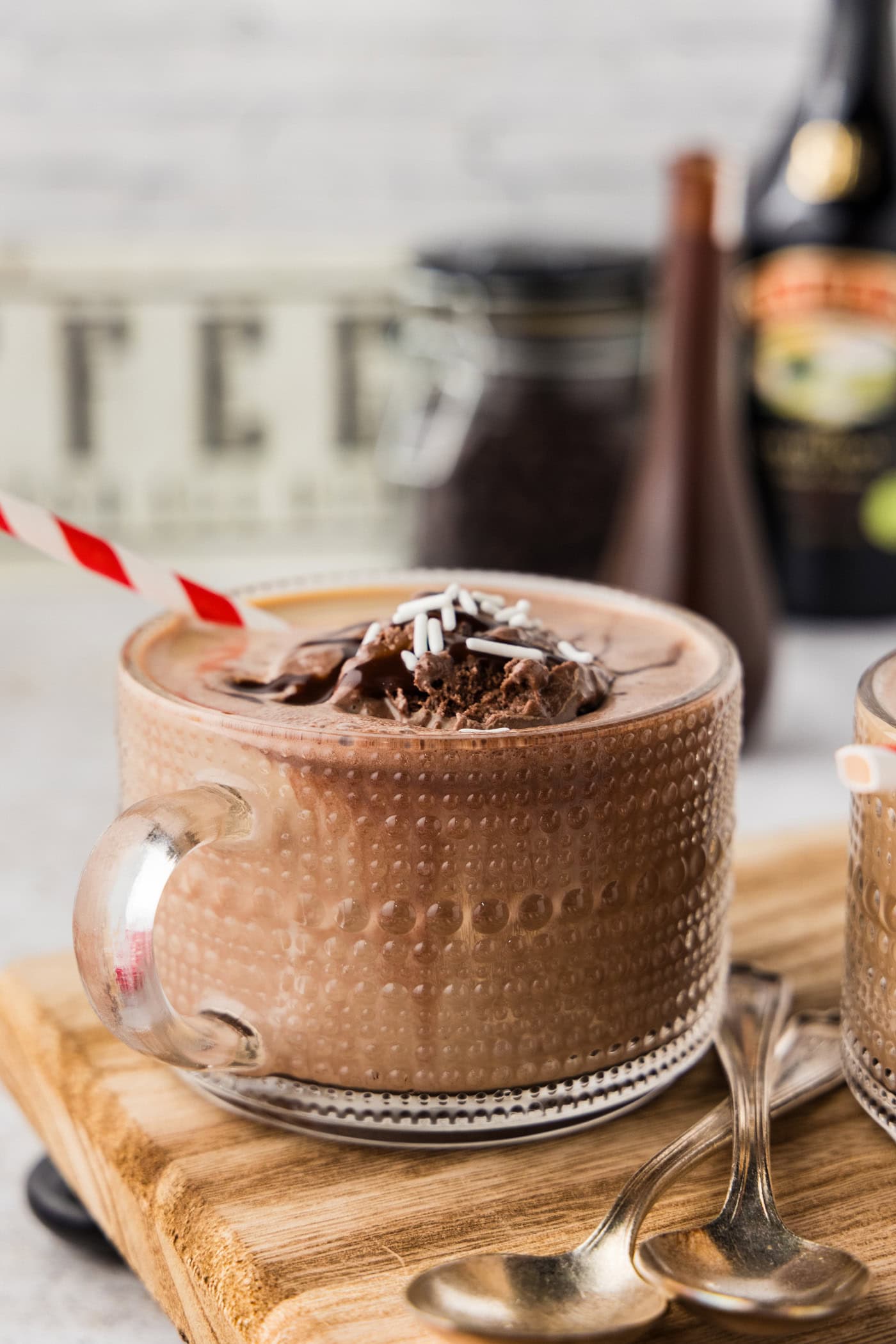 Side photo of a baileys coffee float with chocolate syrup on top