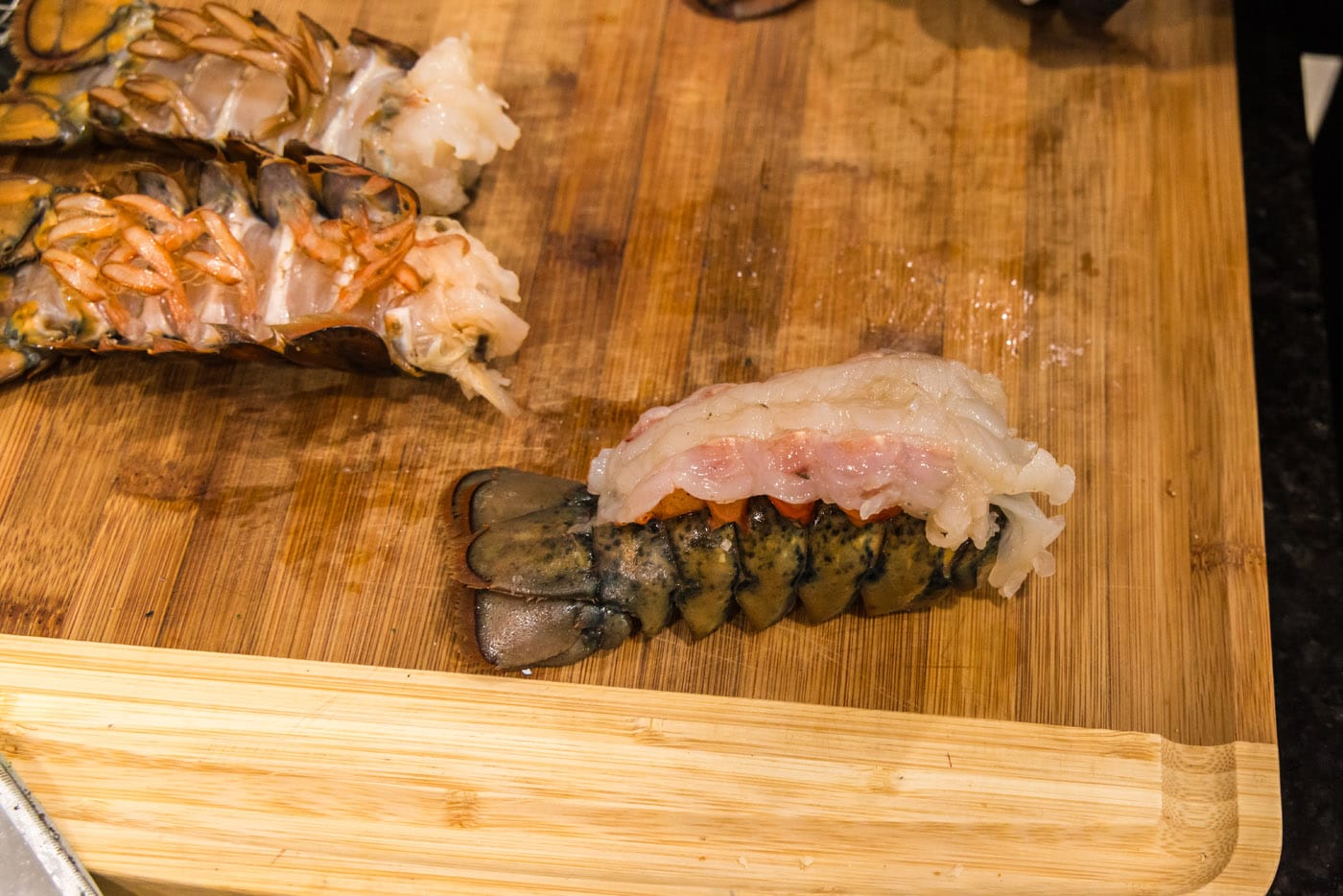 crowned lobster on a cutting board
