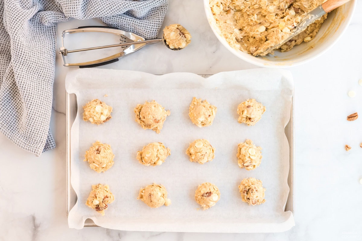 cookie dough balls on baking sheet