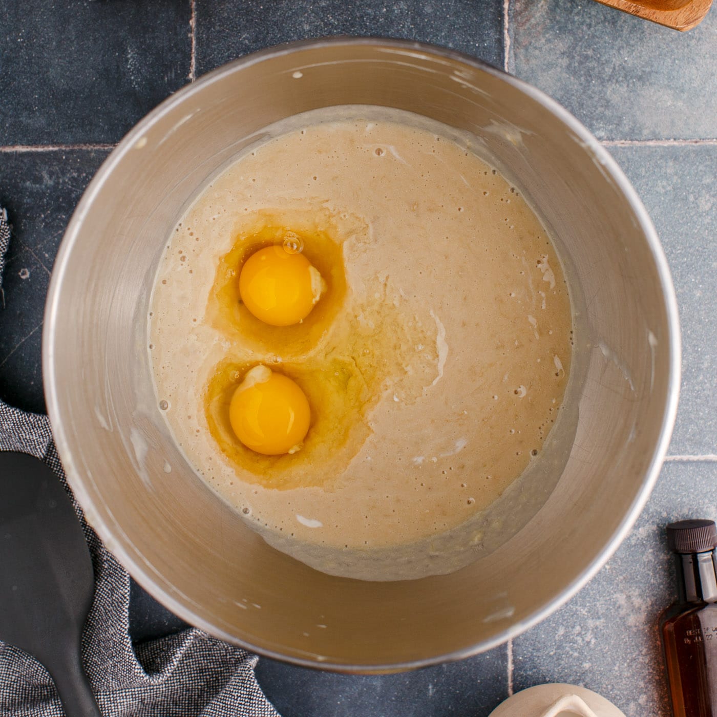 adding eggs to banana muffin batter