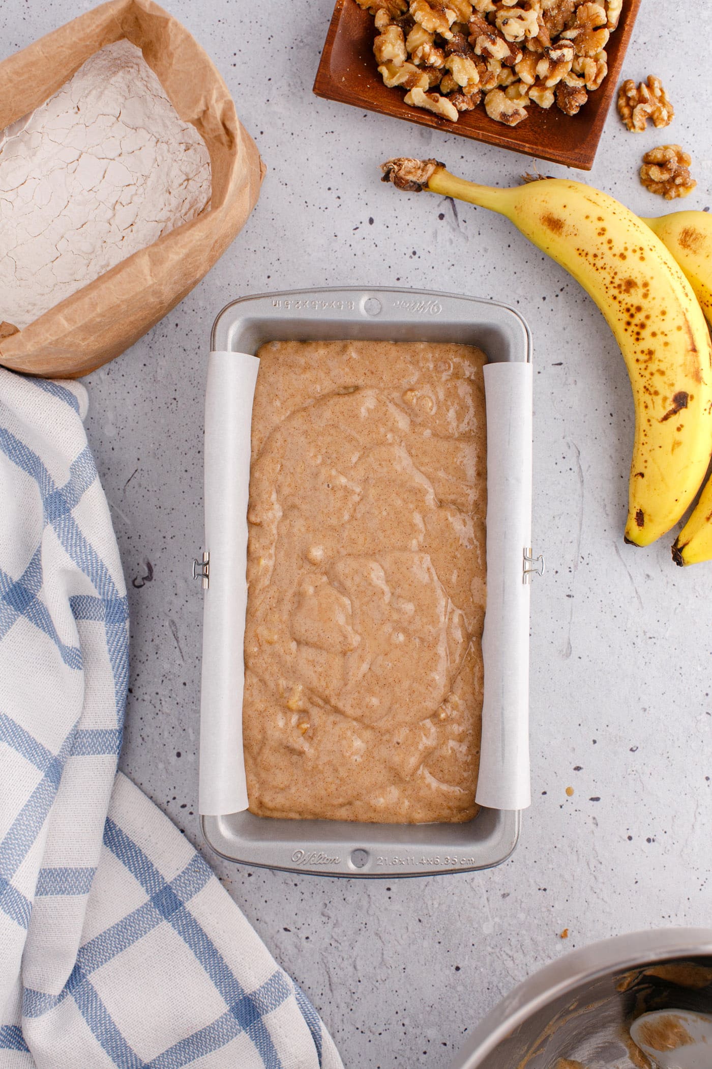 banana bread batter in a loaf pan