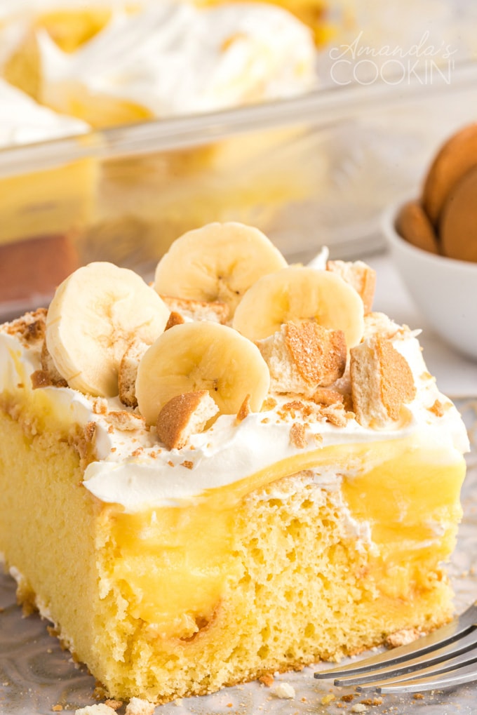 close up photo banana pudding poke cake slice