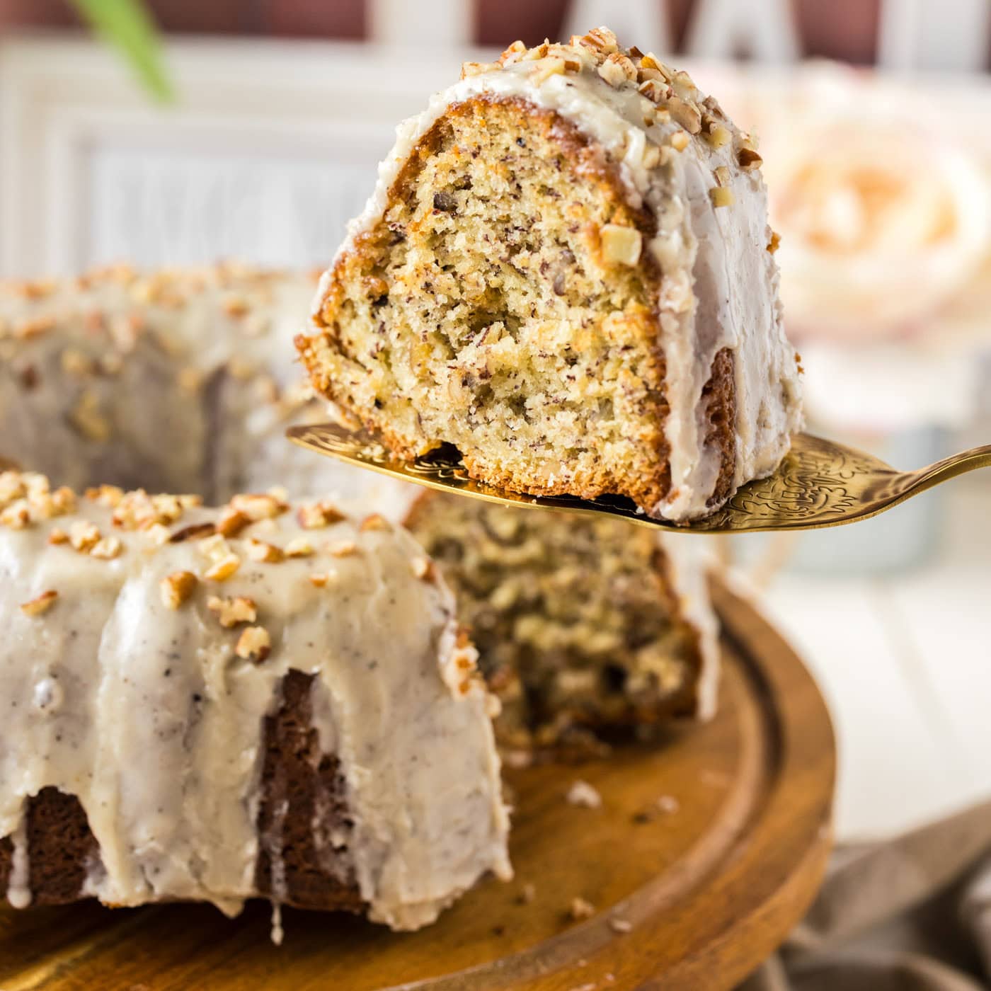 Slice of Banana Bundt Cake held up on a pie server