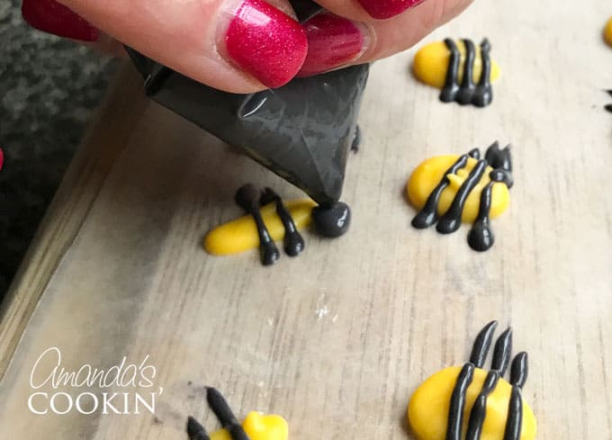 Add the bee head with black candy melts