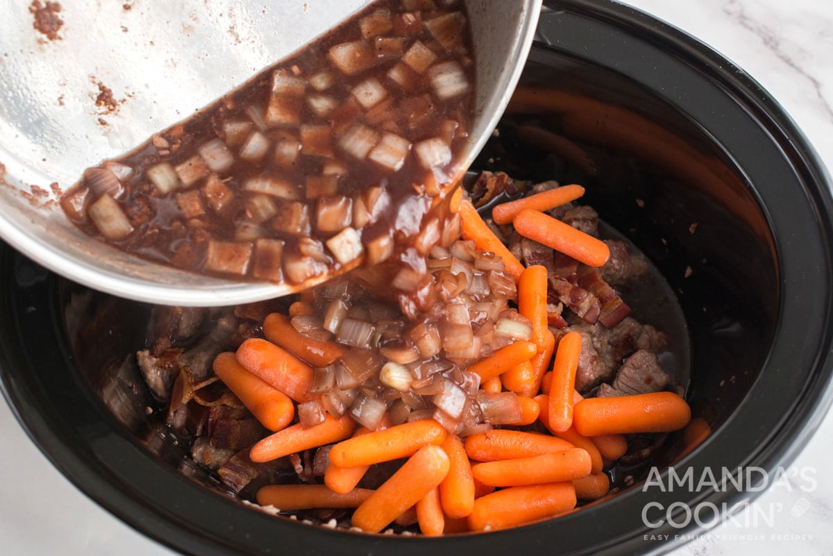 adding wine mixture to crockpot