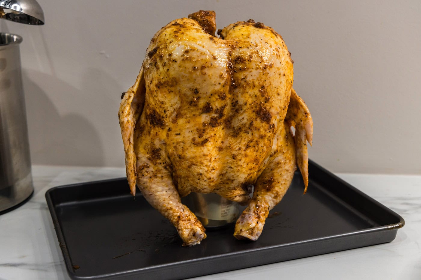 whole chicken on top of a beer can