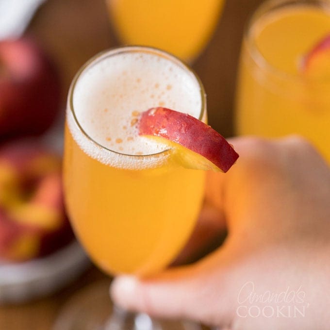 lifting glass of bellini