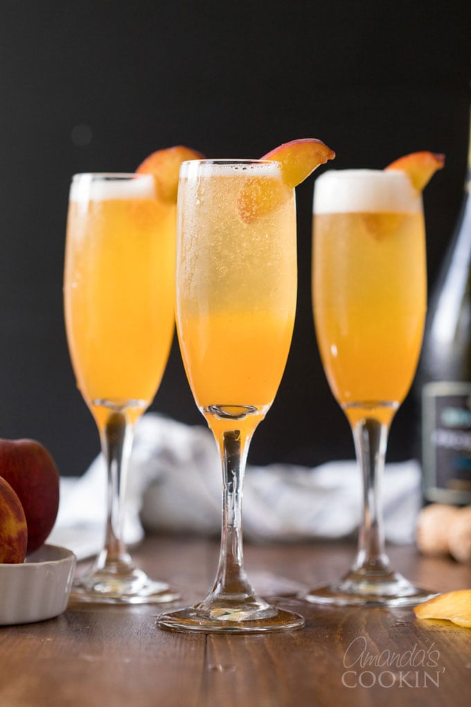 bellini cocktails in champagne flutes