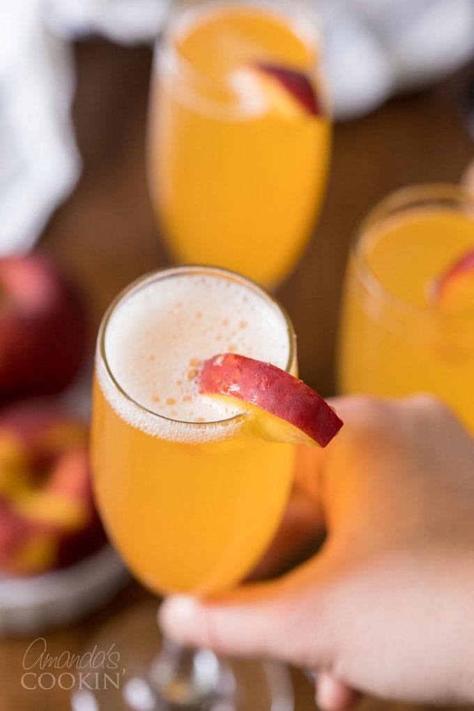 lifting glass of bellini