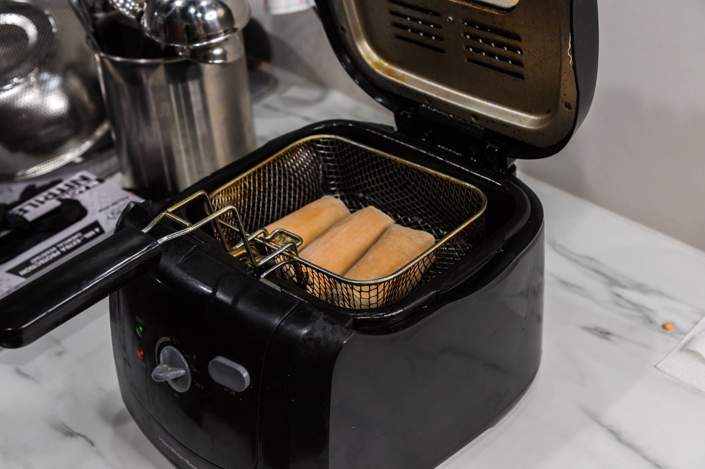 deep frying egg in rolls
