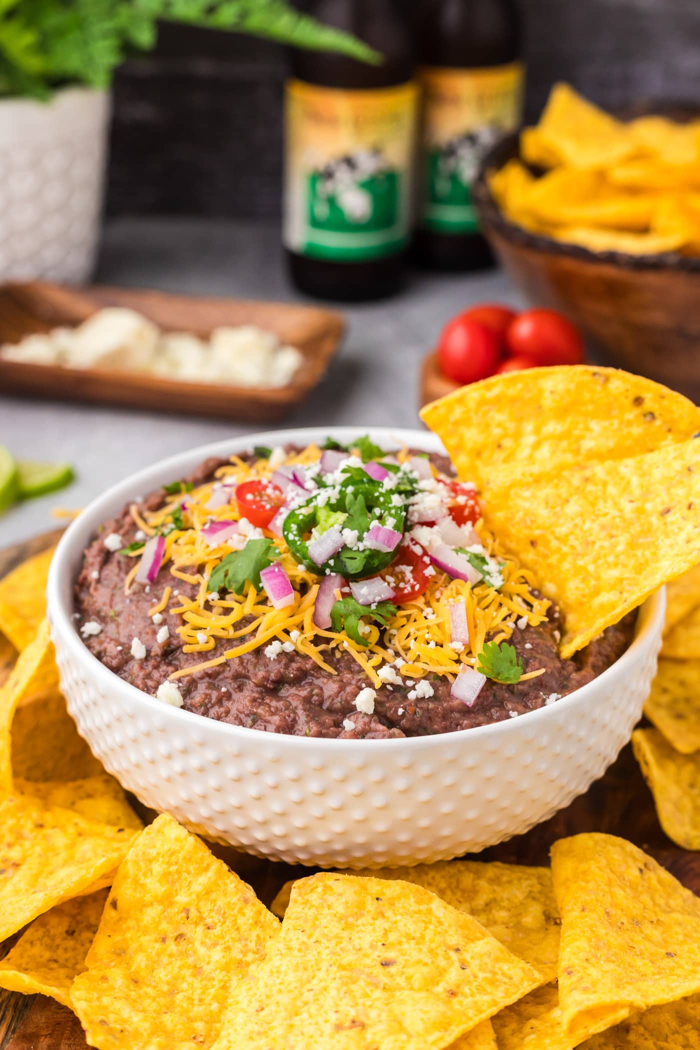 Tortilla chip in a bowl of Black Bean Dip