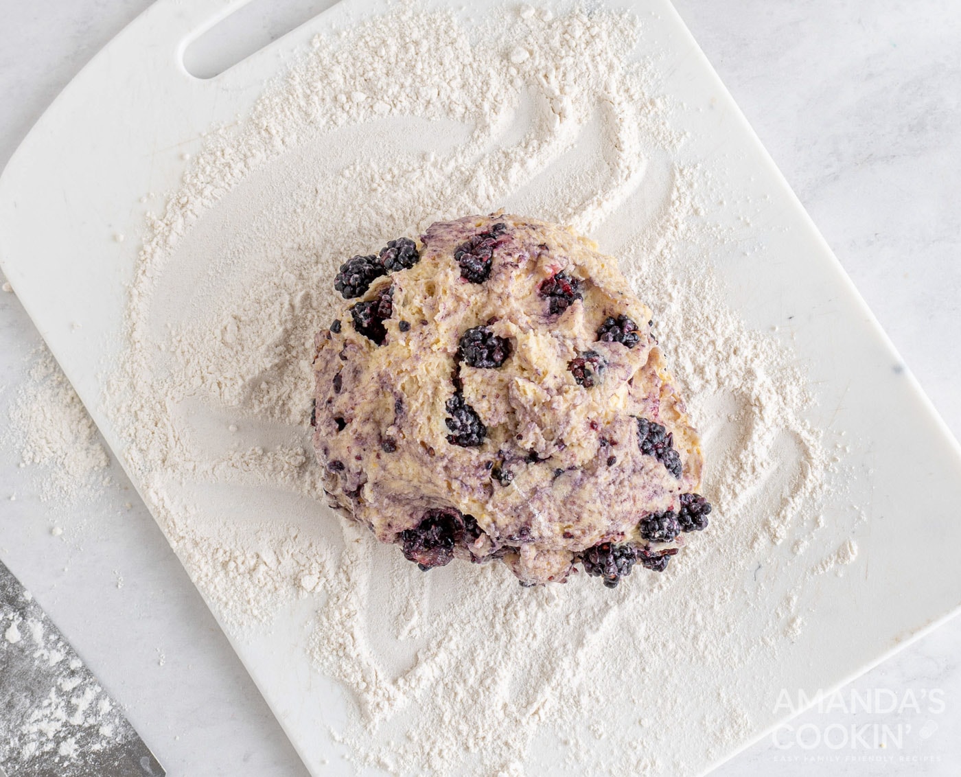 blackberry scone dough on floured cutting board
