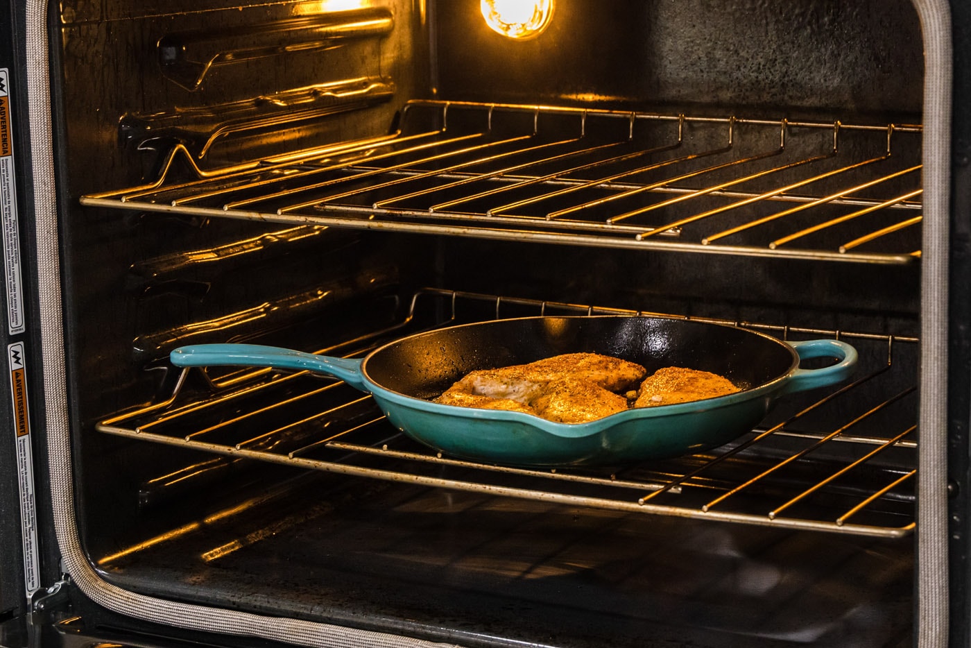 transferring seared chicken breasts to oven