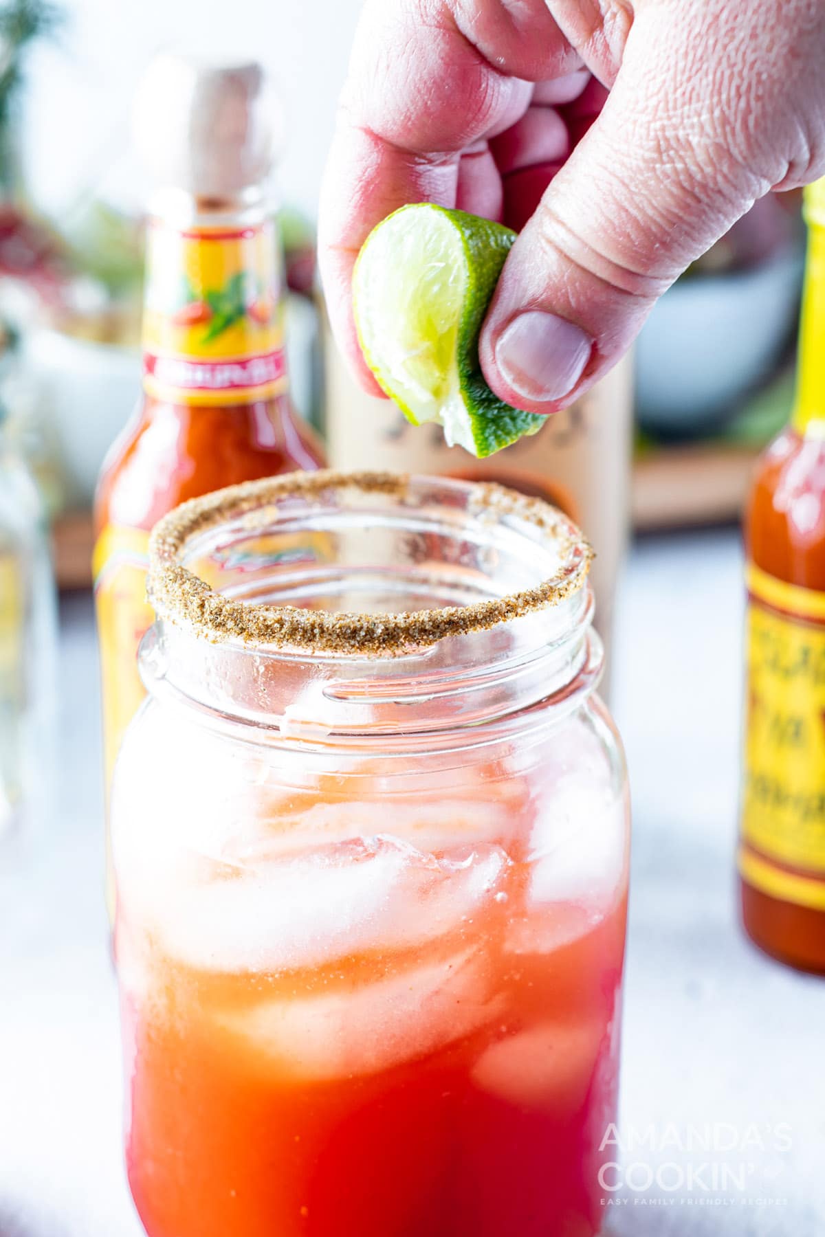 squeezing lime over glass