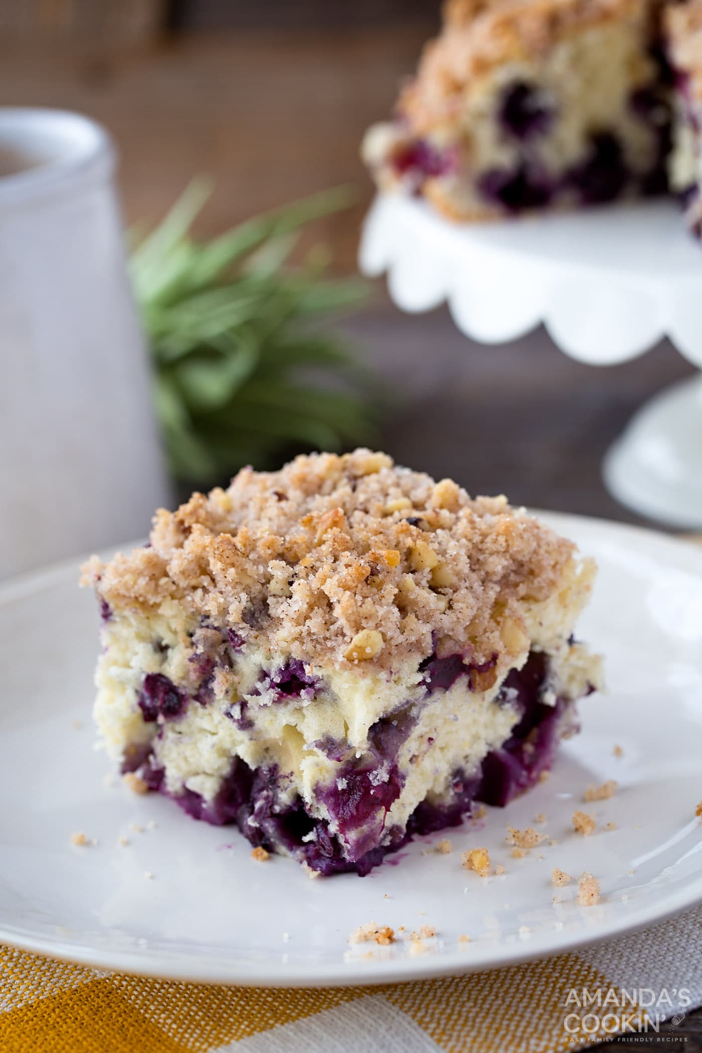 slice of blueberry cake on white plate