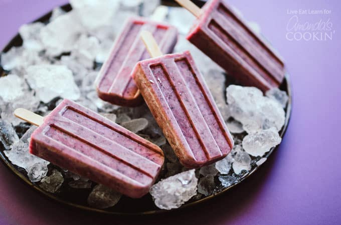 Blueberry Cheesecake Popsicles on a bed of ice