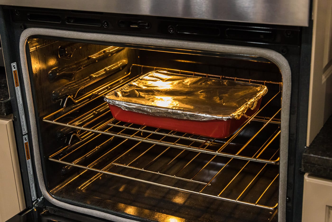 boneless beef short ribs in the oven covered with aluminum foil