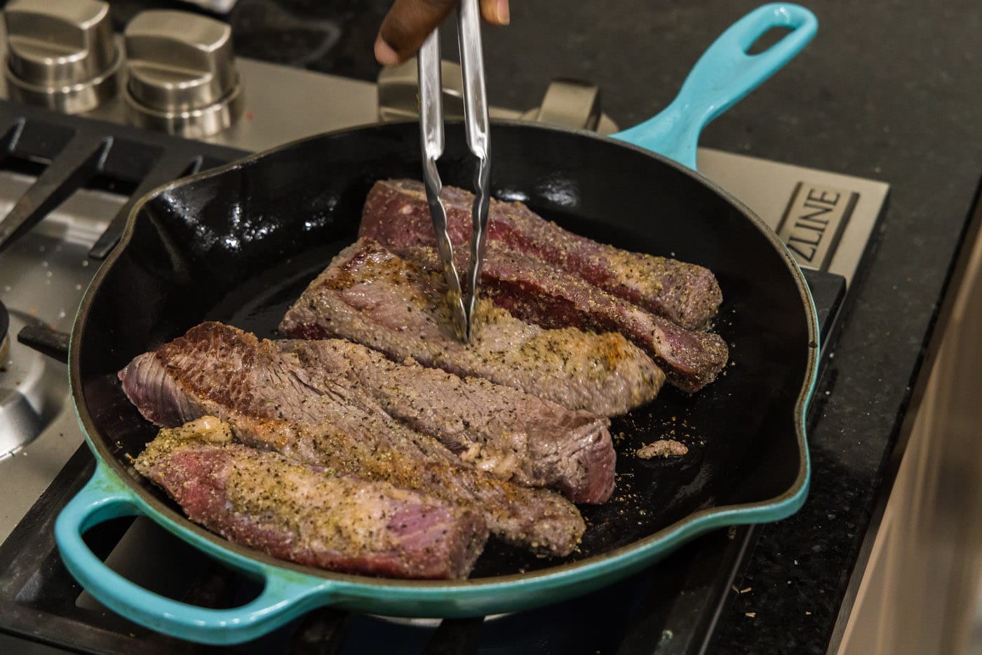 searing boneless beef short ribs in a skillet