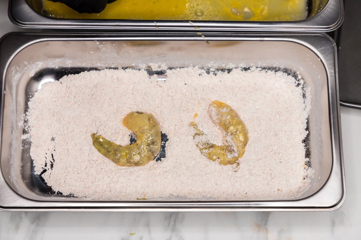 dredging shrimp in flour and egg